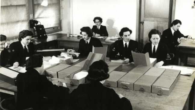 WRANS in the fileroom at FRUMEL. Image from National Archives of Australia (NAA 7648060)