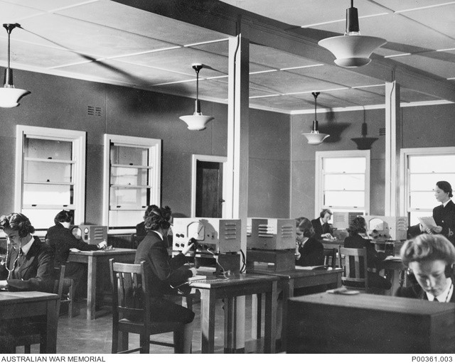 WRANS at work in wireless telegraphy room at HMAS Harman (AWM P00361.003, www.awm.gov.au/collection/C51989)