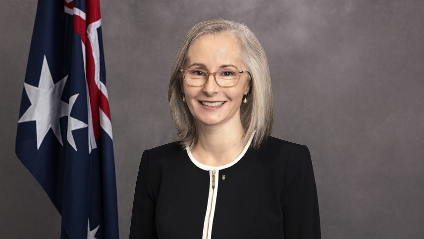 Image of Director-General ASD, Rachel Noble PSM, in front of an Australian flag.