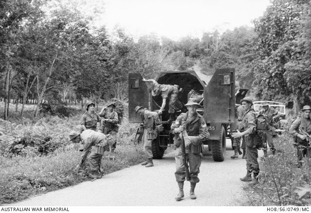 Malayan Emergency - SGT Jock Richardson and platoon exiting truck - AWM HOB/56/0749/MC