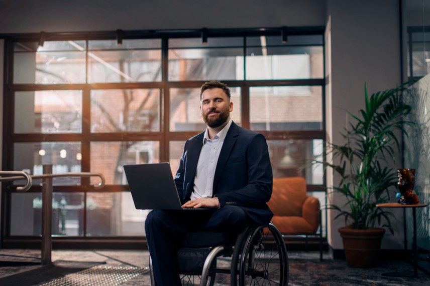 Man in a wheelchair in the workplace
