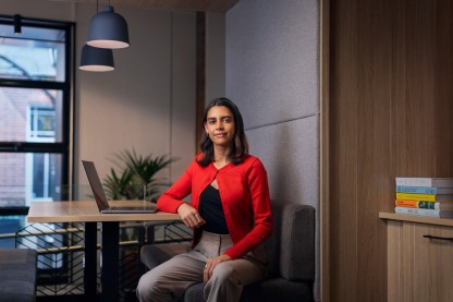 Woman sitting in a collaborative work space