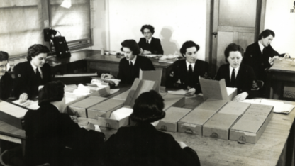 WRANS in the fileroom at FRUMEL. Image from National Archives of Australia (NAA 7648060)